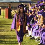 Sequim Gazette photo by Matthew Nash/ Tiffany Lam walks by her classmates as she readies to receive her high school diploma.