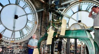 Olympic News Group photo by Dave Logan/
The Clallam County Heritage Advisory Board provided tours of the Clallam County Courthouse clock on Monday, June 1. Mike Doherty, from the board, and Pete Pettit, far right, were part of one group of 10 who climbed a ladder to the room where the clock mechanism is. The clocks workings were manufactured in 1880 in Boston, purchased by Clallam County and installed in the courthouse in 1914. Jefferson County has a similar clock mechanism. (Dave Logan/for Peninsula Daily News)