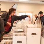 Sequim Gazette photo by Monica Berkseth/ Miranda Knight-Miles, left, and Andy Jauhola, both of Port Townsend, were among those who perused records at Saturdays fourth annual Sequim Record Show.