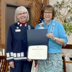 Photo courtesy New Dungeness Chapter, DAR/ Lorri Gilchrist, left, a retired U.S. Navy Commander and member of the New Dungeness Chapter, DAR, recently received a Service for Veterans Award from the Washington State DAR. She is shown here with New Dungeness Chapter DAR Regent Anita Reynolds.