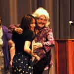 Gloria Dahlquist, center, hugs Kaylee Torres, a Sequim senior, and provided her a scholarship on behalf of the Sequim Philanthropic Educational Organization (P.E.O.). Looking on is Maribeth Kelly, on left.
