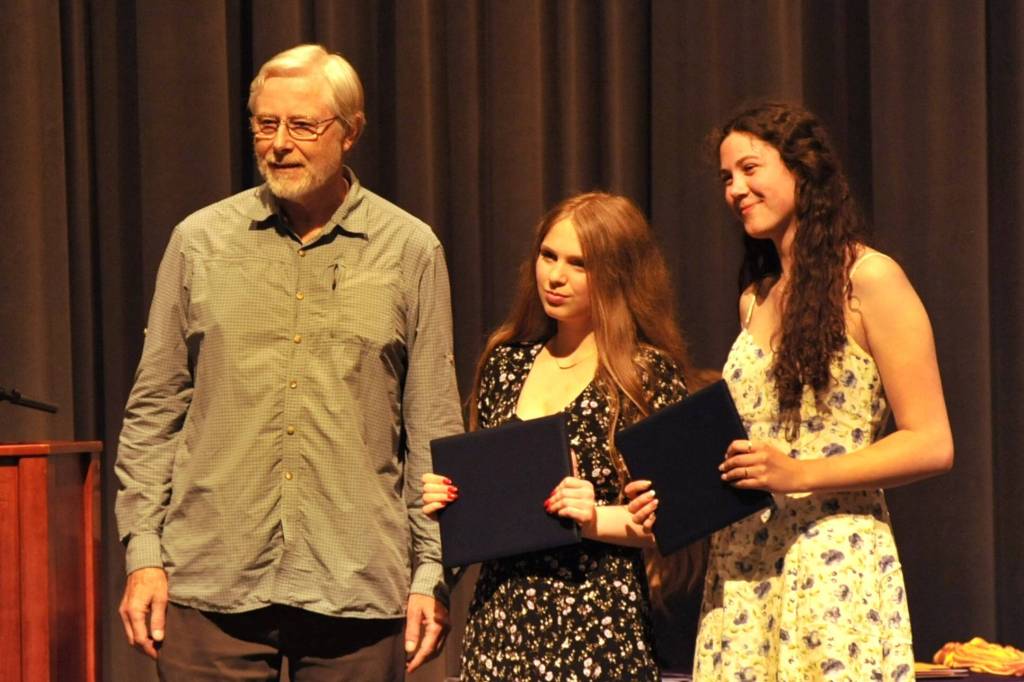 Bob Boekelheide with the Olympic Peninsula Audubon Society awarded two $1,500 scholarships to Elaina Drennen and Laila Sundin.