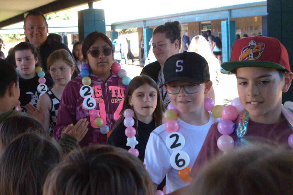 Sequim Gazette photo by Matthew Nash/ Chris Stevens fifth grade class high-five classmates on the last day of school before their Moving On ceremony to celebrate their time in elementary school and moving on to Sequim Middle School.