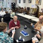 Sequim Gazette photo by Matthew Nash/ Participants with the Sequim Duplicate Bridge Club meet inside KSQM on a recent Friday. The group plays from noon-4:30 p.m. each Friday with $5 to play.