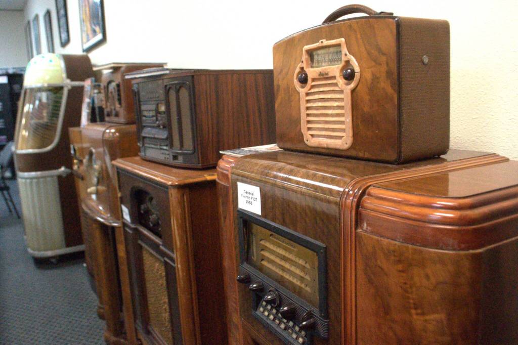 Sequim Gazette photo by Matthew Nash/ Classic radios line the walls of KSQM 91.5 FMs meeting space.