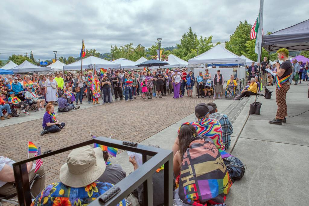 Sequim Gazette file photo by Emily Mathiessen/
 Jaiden Dokken, 2025s Sequim Pride grand marshal, speak during a ceremony at the Sequim Farmers and Artisans Market last year. This years event on June 27 features a ceremony at noon with speakers including, grand marshal Curt Queyrouze, Michael Lowe, Adam Bernbaum, incumbent state representative, D-Port Angeles, Clallam County Commissioner Mark Ozias, and representatives of the Sequim High School Gender-Sexuality Alliance (GSA) who will be the recipient of a planned ceremonial donation.