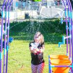 Trillia Kynaston, 5 1/2, of Sequim plays at the splash zone during the City of Sequims Party at the Park on July 4.