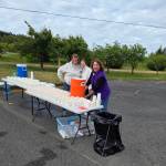 Photo by Beth Pratt 
Manning the chambers water station during the North Olympic Discovery Marathon are, from left, Colleen Robinson (past board president), Heather Nelson (board president-elect) and Sara Nicholls (treasurer).