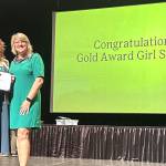 Photo courtesy Heidi Krzyworz
Skylar Krzyworz of Sequim receives her Gold Award, Girl Scouts highest achievement, on June 7 in Federal Way from CEO Andrea Anderson of Girl Scouts of Western Washington.