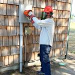 Photo courtesy Clallam County PUD
Clallam County PUD Meter Helper Steve Clum handles an AMI meter change-out.
