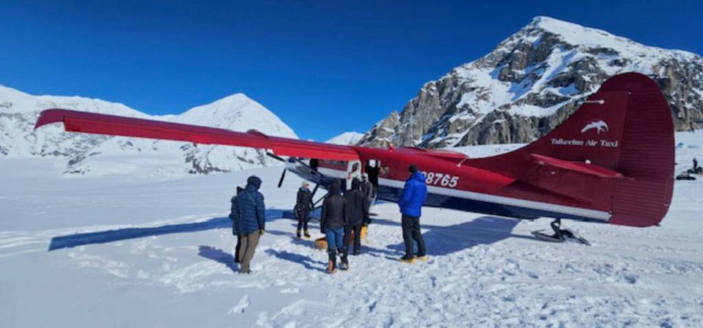 Photo courtesy Paul Balkan/ A Talkeetna Air Taxi prepares to take the weary climbers to Talkeetna after their successful climb.