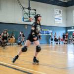 Clallam Countys roller derby team, the Port Scandalous Scandals, warms up for a home court game on Saturday at the Sequim Boys & Girls Club against visitors the Walla Walla Sweets.