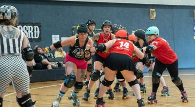 Jaden Friedel, jammer for roller derby home team the Port Scandalous Scandals, breaks free from a block by visiting team the Walla Walla Sweets during last Saturdays game at the Sequim Boys & Girls Club. Walla Walla won with a final score of 175-115.