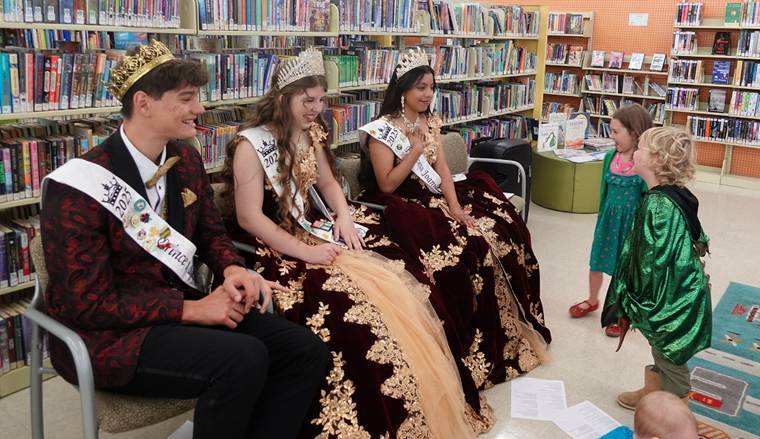Photo courtesy NOLS/ Kids can dress up, enjoy stories and meet this years Sequim Irrigation Festival royalty at the Sequim Library on Wednesday, July 29. Shown here are members of last years royalty court  from left, Malachi Byrne, Joanna Morales and Roxy Woods.
