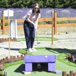Sequim Gazette photo by Matthew Nash 
Maristella Donato of Ballard plays mini-golf at Lit Lavender on July 19 while visiting farms with Lukas Comstock and Isabella Jennings. Comstock said they like the idea of supporting small businesses and theyre all fans of lavender. It was the trios first time visiting the farm, they said.