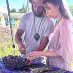 Sequim Gazette photo by Matthew Nash 
Brandon Denham and Bonnie Toye of Port Angeles work together to make a lavender wreath at Melis Lavender. The couple moved to the area in January, they said, and they made a plan to visit many farms.