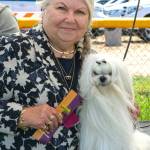 Pamela Armstrong of Federal Way holds her dog Ollie who won some ribbons at the Hurricane Ridge Kennel Clubs All Breed Dog Show held July 24-26 at Carrie Blake Community Park. Armstrong said shes come to Sequim since the 1990s and attends the show every year.