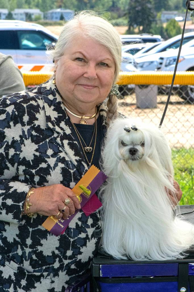 Pamela Armstrong of Federal Way holds her dog Ollie who won some ribbons at the Hurricane Ridge Kennel Clubs All Breed Dog Show held July 24-26 at Carrie Blake Community Park. Armstrong said shes come to Sequim since the 1990s and attends the show every year.