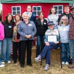 Sequim Gazette photo by Monica Berkseth 
Members of the Dick and Hunt families were honored by the North Olympic Land Trust on July 26 for The Dick Family Farms legacy over the last 100-plus years. It continues to be a working farm today. The Land Trust purchased the property with the intent to keep it as farmland indefinitely.