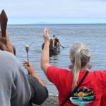 Representatives with the Jamestown SKlallam Tribe welcome a canoe family on July 24 on Jamestown Beach as part of the 2026 Paddle to Medicine Creek Nisqually Potlach.