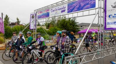 Sequim Gazette photo by Tom Buscher/ Tour de Lavender participants line up at the Sequim Boys & Girls Club early Saturday morning, Aug. 1, to begin the annual bicycle ride  either the 35-mile Fun Ride or the 64-mile Metric Century route through the Sequim-Dungeness area, with proceeds supporting the Peninsula Trails Coalitions efforts to improve and maintain the Olympic Discovery Trail.