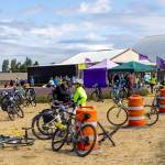Sequim Gazette photo by Tom Buscher/ Tour de Lavender participants gather with their bicycles at a support station at B&B Lavender Farm just after noon on Saturday, Aug. 1. Riders stopped for refreshments and any needed assistance before continuing the route that took them to six lavender farms as part of the fundraiser for the Peninsula Trails Coalition.