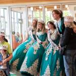 Two-year-old Charles Salyer and mother Emily Salyer, far left, and Charles grandmother, Susanna Hafner, right, pose with the 2026 Sequim Irrigation Festival Royal Court during Storytime with the Royal Court at the Sequim Library. The teens read aloud to children and their families as part of the North Olympic Library Systems (NOLS) Plant a Seed, Read Summer Reading Program.