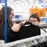 Adrienne Kaestner, left, helps her son Robert, 10, shop for clothing on Saturday, Aug. 1. Participating families received a $100 gift card per child to shop for back-to-school items at Ross, thanks to donations made to the nonprofit Having Understanding Means Acting Now (H.U.M.A.N.).