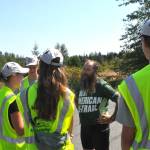 Sequim Gazette photo by Matthew Nash/ Sequim Gazette photo by Matthew Nash/ Patrick Smith of Florida greets Peninsula Trail Coalition trail ambassadors on Aug. 3.