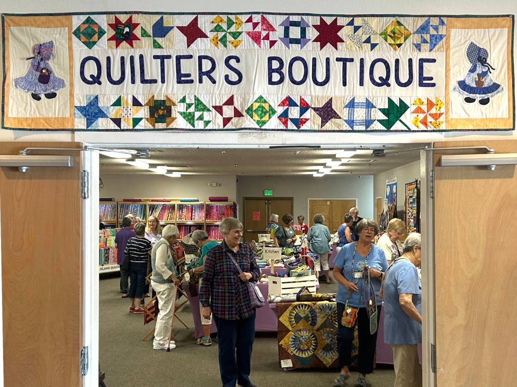 Sequim Gazette photo by Matthew Nash/ The Quilters Boutique hosted thousands of items made by local quilters to support the Sunbonnet Sue Quilt Club.
