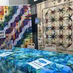 Sequim Gazette photo by Matthew Nash/ Next years Raffle Quilt, left, was on display next to this years quilt, which sold out of tickets on Aug. 7 at the Sunbonnet Sue Quilt Clubs annual show. Tickets support the nonprofit clubs efforts.