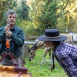 Sequim Gazette photos by Tom Buscher 
Volunteer packers Matthew Tuller, left, and Rachael Taylor-Tuller weigh gear at the Hoh River Trail stock corral on Aug. 5 before loading the pack animals. Equipment is balanced by weight on either side of a pack saddle to keep the load stable on the trail.