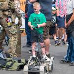 Sequim Gazette photo by Monica Berkseth/ Jackson Walchok, 6, of Seabeck tries his hand driving the robot for the Explosive Ordnance Disposal (EOD) Detachment Bangor.