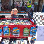 Sequim Gazette photo by Monica Berkseth/ Three-year-old Fish Ebell of Port Angeles finds his favorite new car from a new effort called the Sequim Little Car Swap, which set up shop in front of Sunshine Cafe during Sequim Prairie Nights. The swaps organizers hope to be at more events in the future. Look for more information at facebook.com/sequimlittlecarswap.
