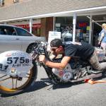 Sequim Gazette photo by Monica Berkseth 
Alan McMurray of Sequim with the Tri-Mac Speedsters shows his Bonneville Salt Flats land-speed racing motorcycle in front of A-1 Auto Parts, one of the sponsors supporting the teams Bonneville Speed Week efforts. McMurray said he has reached 95 mph so far and hopes to reach 120 mph. McMurray and his father George have competed for land-speed records before.